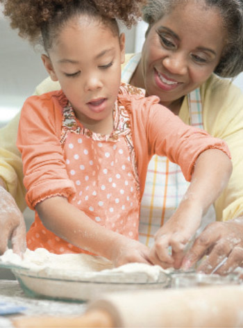 child with Mom baking
