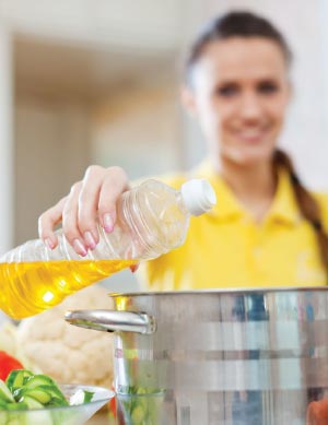 woman pouring oil