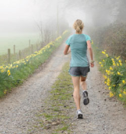 woman running countryroad
