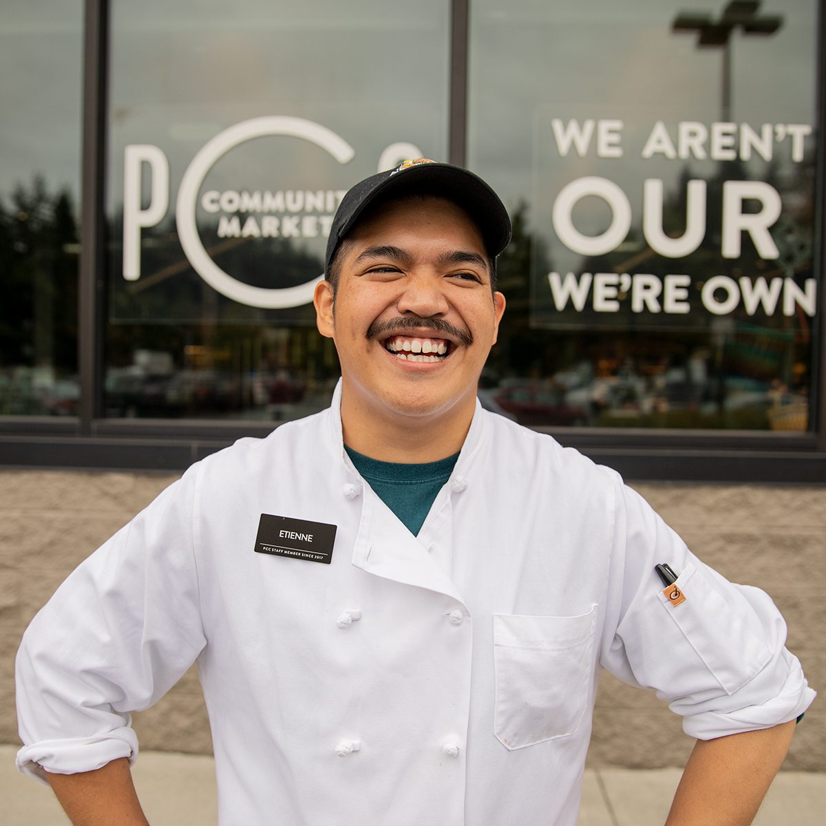 Etienne in front of store