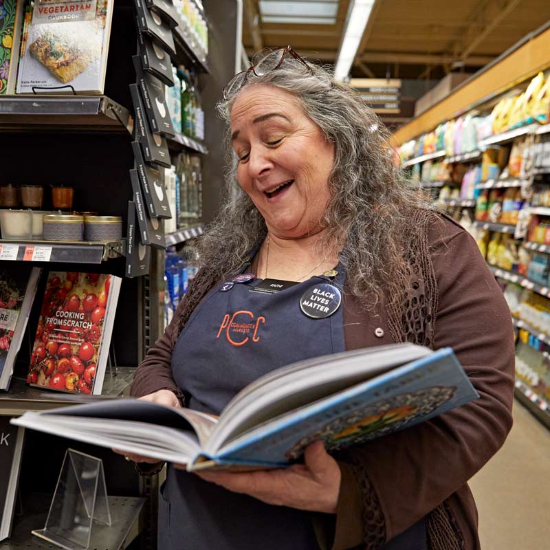 Kathi holding a cookbook