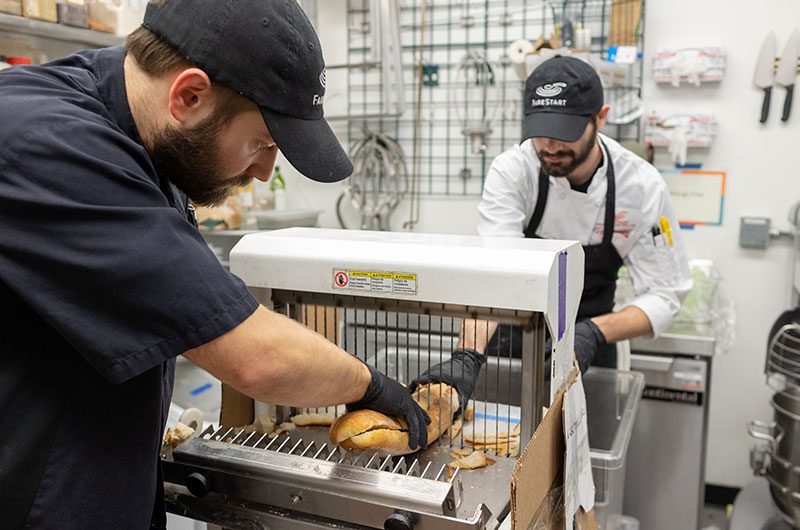 Bread going through slicer